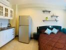 Compact studio apartment with integrated kitchen and sleeping area