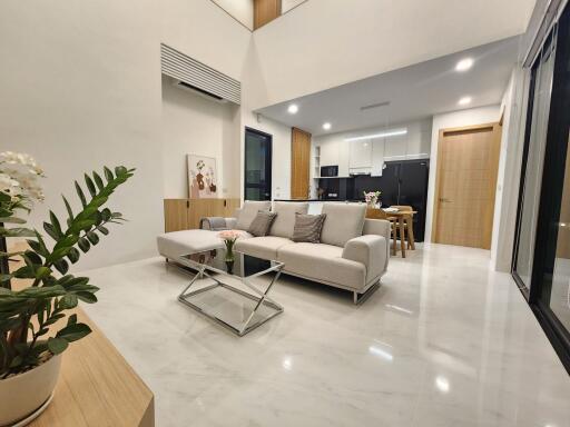 Modern spacious living room with integrated kitchen