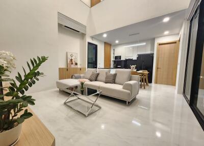 Modern spacious living room with integrated kitchen