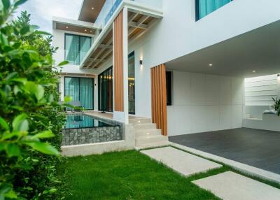 Modern residential home exterior with swimming pool