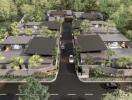 Aerial view of a modern residential housing complex surrounded by lush greenery