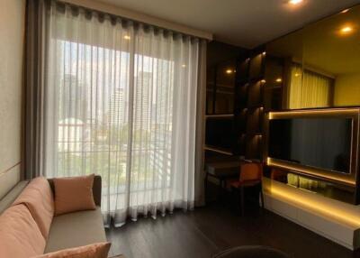 Modern living room with large window and custom shelving