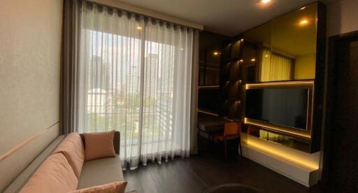 Modern living room with large window and custom shelving