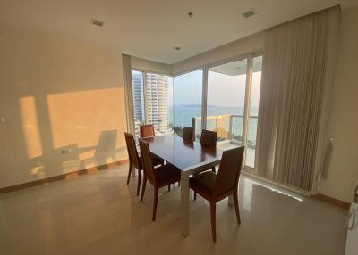 Spacious dining room with large windows overlooking the ocean