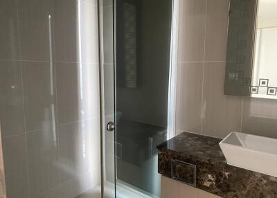 Modern bathroom with glass shower and elegant sink