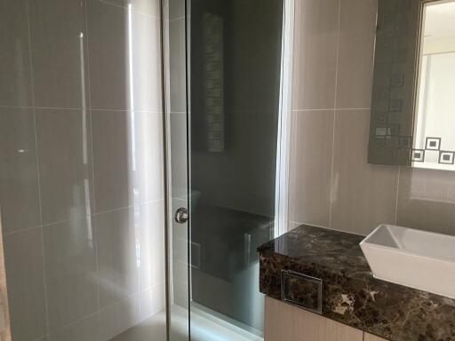 Modern bathroom with glass shower and elegant sink