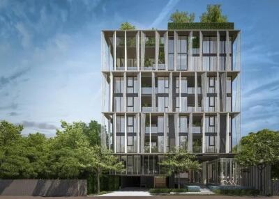 Modern multi-story residential building with external green landscaping