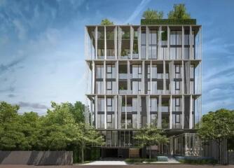 Modern multi-story residential building with external green landscaping