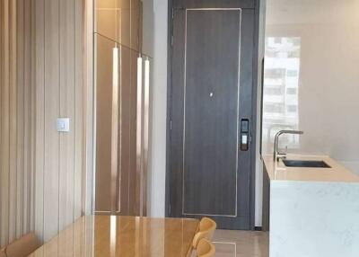 Modern kitchen with sleek design featuring a marble countertop and stylish cabinetry