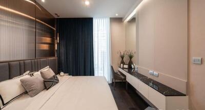 Modern bedroom with stylish decor and ample lighting