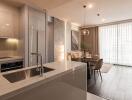 Modern kitchen with integrated dining area featuring stylish design and appliances