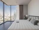 Modern bedroom with large windows and city view