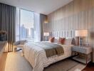 Modern bedroom with panoramic city view through large windows