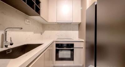 Modern compact kitchen with integrated appliances