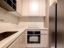 Modern compact kitchen with integrated appliances