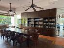 Spacious living room with library and dining area