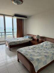 Spacious bedroom with ocean view and large windows