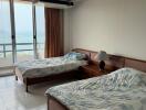 Spacious bedroom with ocean view and large windows