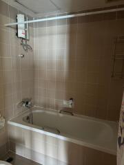 Spacious bathroom with tub and shower unit