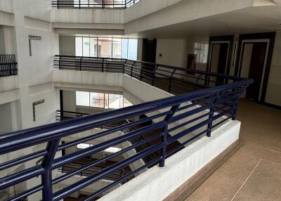 Spacious and well-lit interior common area of a modern apartment building