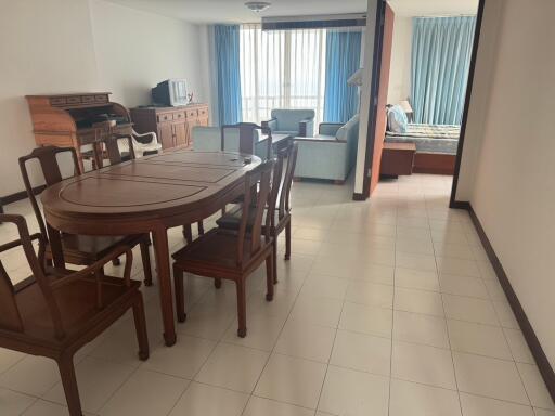 Spacious living room with dining area and ample natural light