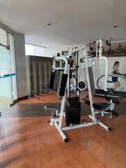 Home gym with exercise equipment and pool view