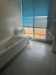 Modern bathroom with blue shades and abundant natural light