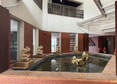 Elegant indoor fountain area with decorative sculptures