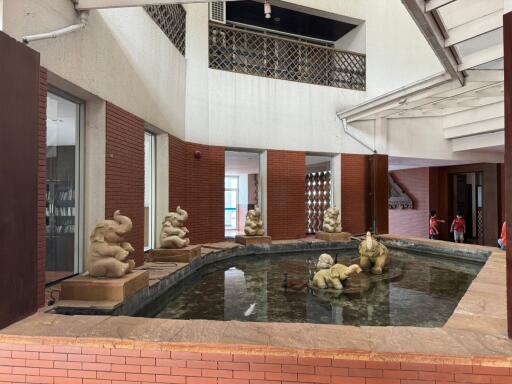 Elegant indoor fountain area with decorative sculptures