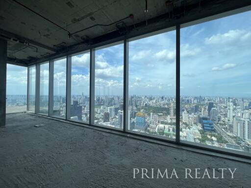 High-rise building interior view with large windows overlooking the city