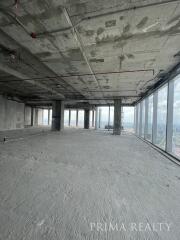 Unfinished high-rise building interior overlooking city