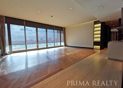 Spacious living room with large windows and city view