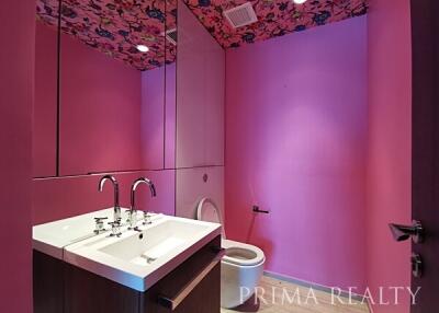 Bright pink modern bathroom with floral ceiling