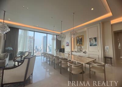 Luxurious living room with modern dining area and city view