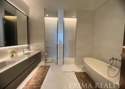 Elegant modern bathroom with a freestanding bathtub and double vanity
