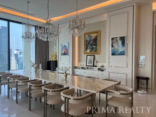 Elegant dining room with large table and luxurious decor overlooking the city