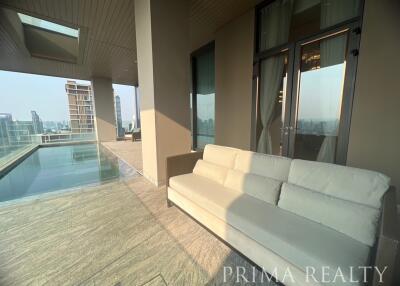 Modern balcony with a sofa and a scenic city view