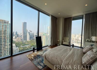 Luxurious high-rise bedroom with panoramic city views