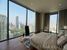 Luxurious high-rise bedroom with panoramic city views