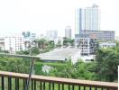 Spacious balcony with an urban view