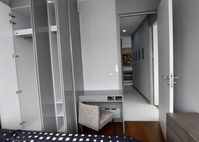 Modern bedroom with integrated workstation and ample wardrobe