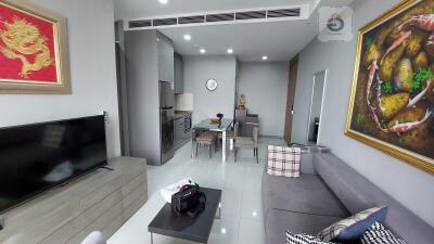 Modern furnished living room with kitchen and dining area