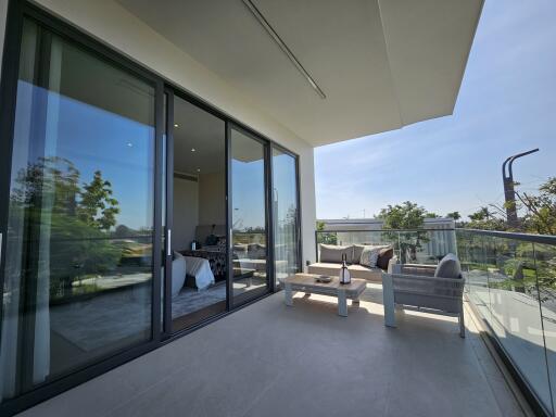 Spacious balcony with modern furniture and scenic views