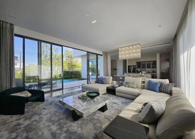 Spacious modern living room with large windows and luxurious decor