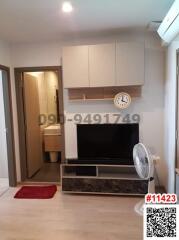 Compact living room with TV cabinet and adjoining bathroom