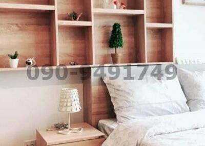 Cozy and modern bedroom interior with wooden furniture