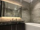 Modern bathroom with marble finishes and elegant fixtures