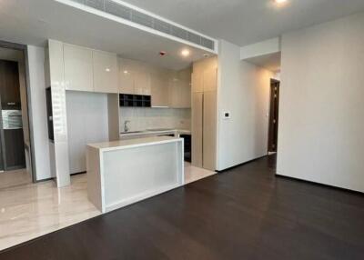 Modern kitchen with integrated appliances and spacious living area