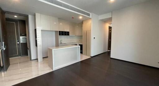 Modern kitchen with integrated appliances and spacious living area