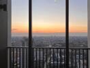 Stunning city view from high-rise balcony at sunset